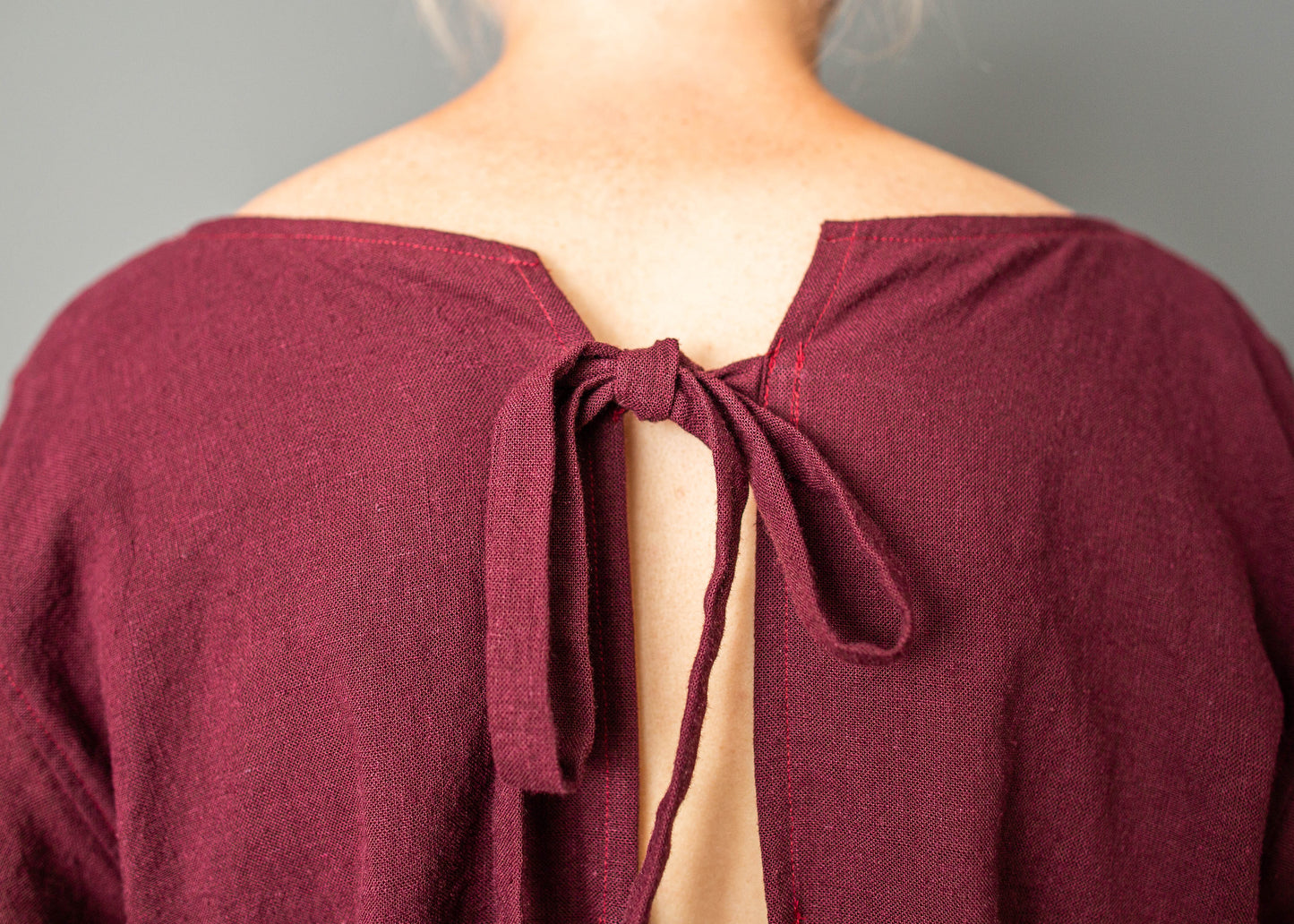 Cropped burgundy linen shirt with tie closure and open back